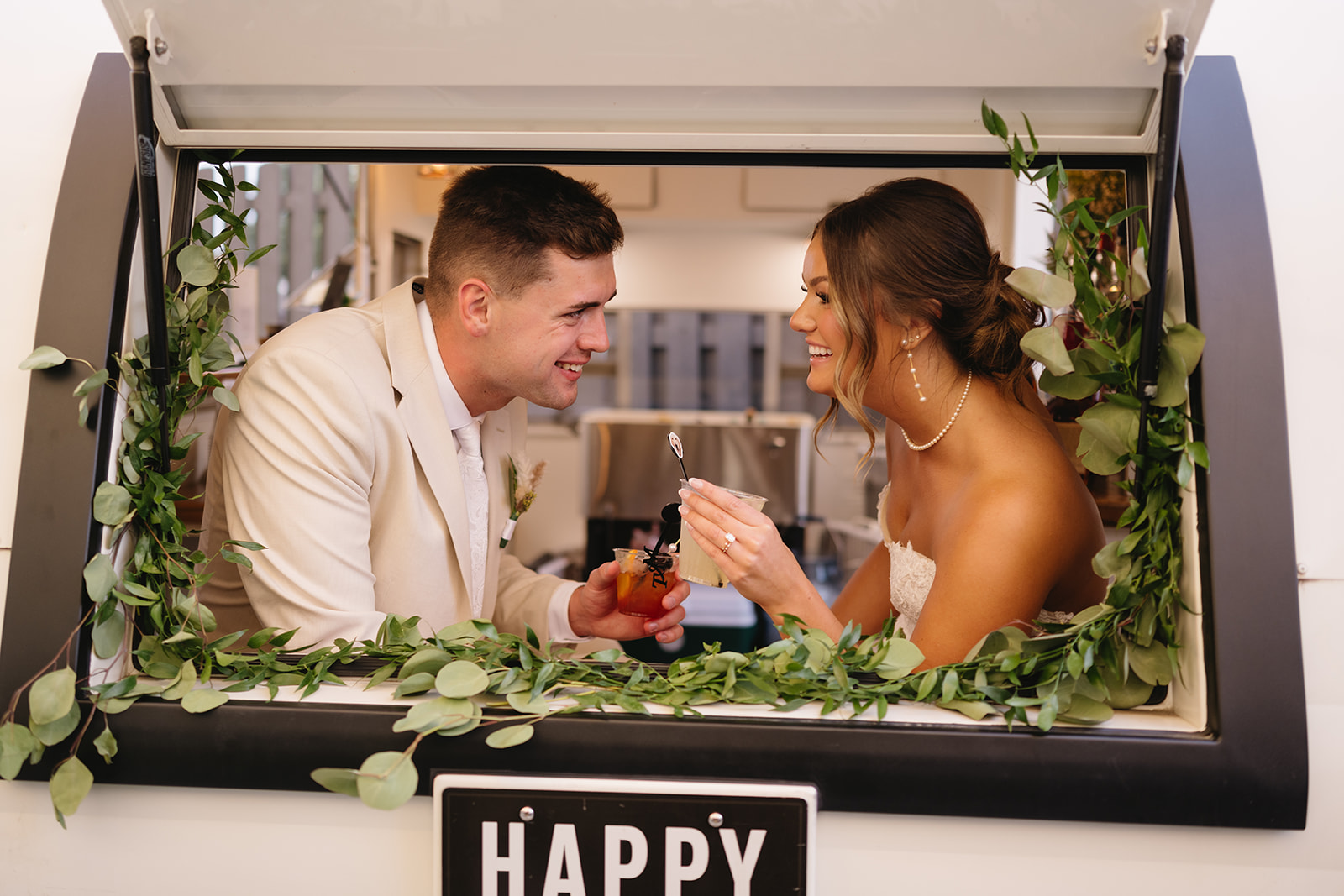 Couple Enjoying Drinks in Camper Bar, Suesanna